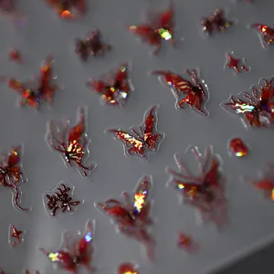 Deep red holographic butterfly nail stickers with 3D embossed texture and chrome finish