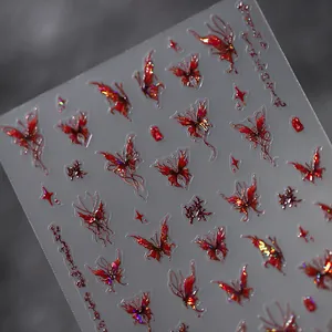 Holographic red butterfly nail stickers with metallic finish and artistic script design