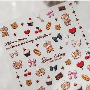 Macro detail of 3D embossed bear and bakery themed nail art stickers with relief texture