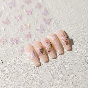 Detailed macro view of 3D iridescent butterfly nail stickers with colorful stone accents