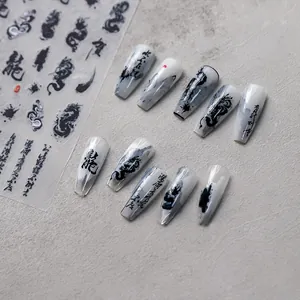 Detailed view of Ink dragon nail art stickers with black calligraphy and dragon patterns