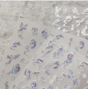 Detailed view of 3D laser holographic nail art stickers with dragon and phoenix designs