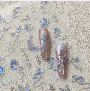 Detailed laser nail stickers with holographic dragon and phoenix patterns in 3D effect