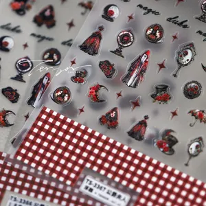 Macro view of 5D embossed gothic nail art stickers featuring red roses and magic mirrors