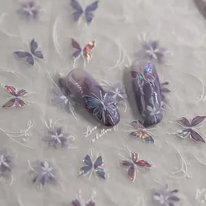 Purple holographic butterfly nail stickers with floral patterns and gold foil details