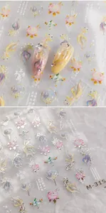 Detail of M-315 nail art stickers featuring koi fish and gold floral ink patterns