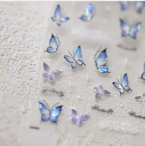 Macro view of iridescent butterfly nail art stickers with purple and blue laser foil finish