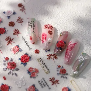 Exquisite nail stickers with red roses and butterflies on pink gradient manicure