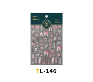 Detailed view of 5D embossed nail art stickers with cranes and pink lotus motifs