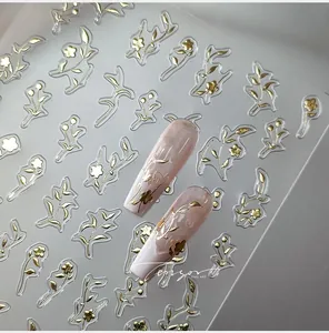 5D embossed gold flower nail stickers with metallic relief texture on pink nails