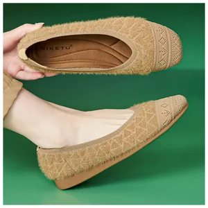 Detail of plush knit flat shoes with quilted side texture and soft faux fur lining