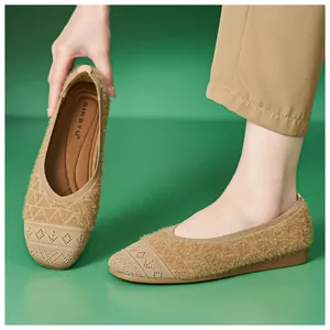 Macro detail of plush texture and knitted geometric pattern on flat comfort shoes