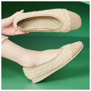 Detail of beige knit flats with diamond texture and soft plush interior lining