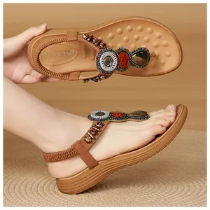 Detail of bohemian wedge sandals with colorful beads, rhinestones and padded massage insole