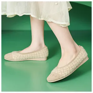 Close-up of beige knit texture and plush details on women's low-heel loafers