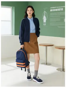 Detail view of a navy blue canvas backpack with orange contrast stripes for casual wear