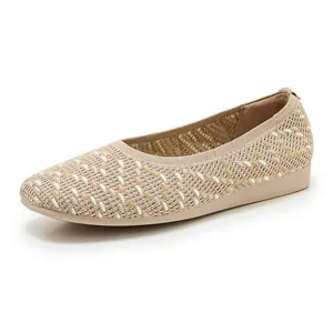 Detail view of beige breathable knit loafers with cushioned platform soles and woven texture