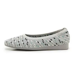 Detail shot of the breathable knitted texture on these grey pointed toe flat shoes