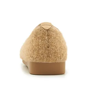 Rear view of light brown plush knit flats showing soft faux fur texture and rubber soles