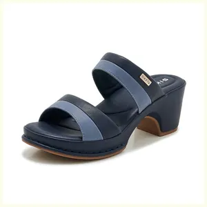 Detail view of two-tone navy and light blue mule sandals with stable block heel
