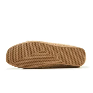 Detail view of anti-slip rubber sole and 36 size mark on brown plush flat shoes