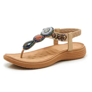 Close-up of Bohemian sandals with colorful beads, jewels and cushioned massage footbed