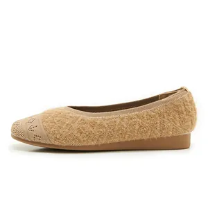 Detail view of khaki faux-fur ballet flats featuring knit toe box and rubber sole