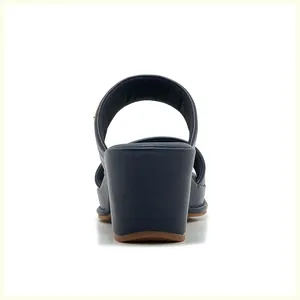 Rear view of navy blue block heel sandal with premium leather texture and stitching