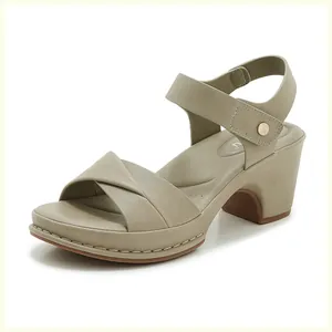 Detail of khaki block heel sandal with cross straps and adjustable ankle gold buckle