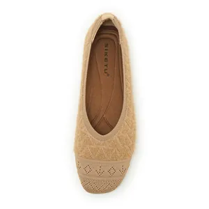 Detailed top view of light brown knit flat shoe featuring a textured diamond pattern