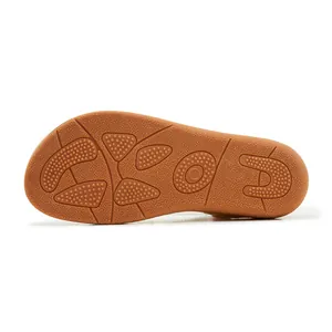 Close-up of non-slip rubber sole with grip patterns for bohemian rhinestone sandals