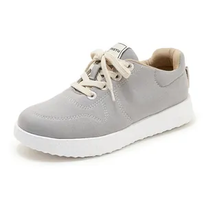 Detail shot of the textured thick rubber sole and grey canvas upper of the casual sneaker