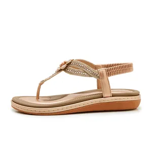 Detailed side view of Bohemian rhinestone flower sandals with elastic heel and T-strap