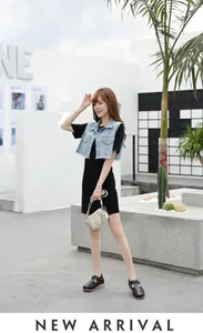 Fashionable women's denim vest with fringe and black cutout platform wedge shoes
