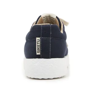 Detail showing breathable merino wool material and anti-slip white rubber sole of casual shoe