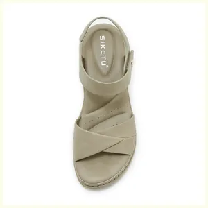 Close-up of khaki block heel sandals with SIKETU brand logo and cross strap stitching