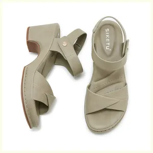 Detailed top view of women's block heel sandals featuring khaki green cross straps