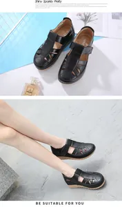 Detailed view of black wedge sandals featuring breathable cut-outs and velcro straps
