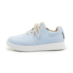 Detailed side view of light blue canvas sneakers with thick white anti-slip soles