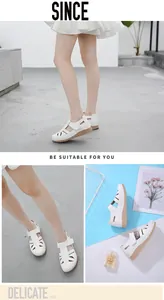 Detail of white hollowed-out wedge shoes with stitching and textured rubber sole