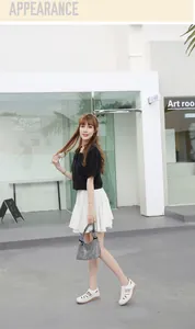 Outdoor street style view of white wedge sandals with hollow out design and platform sole