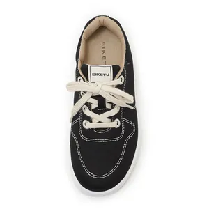 Top view of black canvas lace-up sneakers with white stitching and branded SIKETU insole