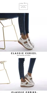 Detail of white hollow-out platform shoes with velcro straps and brown rubber soles
