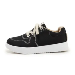 Women's lightweight black canvas sneakers with thick anti-slip sole and white stitching