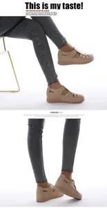 Detail view of beige wedge hollow-out shoes with velcro straps and stitching
