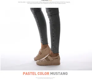 Detail of wedge heel casual shoes with hollow weaving and adjustable velcro strap
