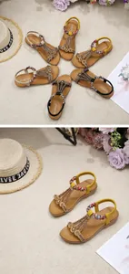 Detail of bohemian flat sandals with colorful ethnic beads and elastic heel straps