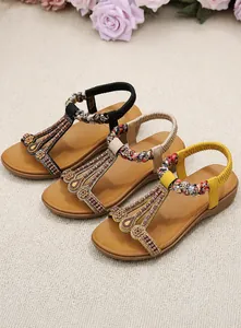 Flat bohemian summer sandals with intricate beadwork and elastic back straps in three colors