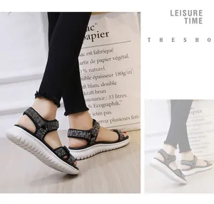 Detail of summer platform sports sandals with black and white checkered straps and thick sole