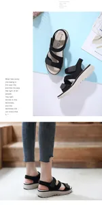 Detail of black wedge platform sandals with adjustable hook and loop straps and non-slip sole